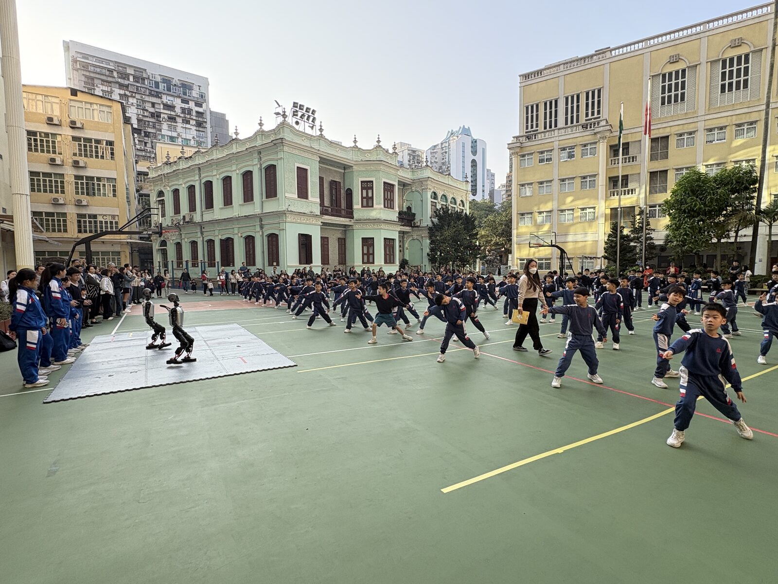The robot joins the students' morning exercise routine