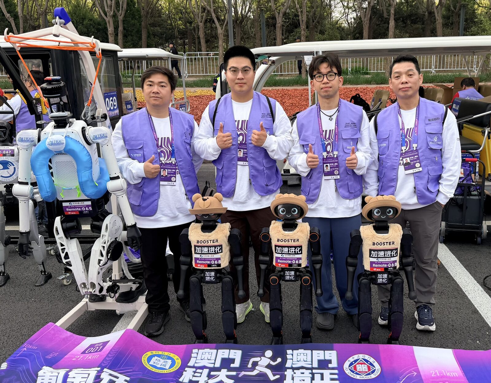 The Brazil–Macau joint team with their Booster K1 robots