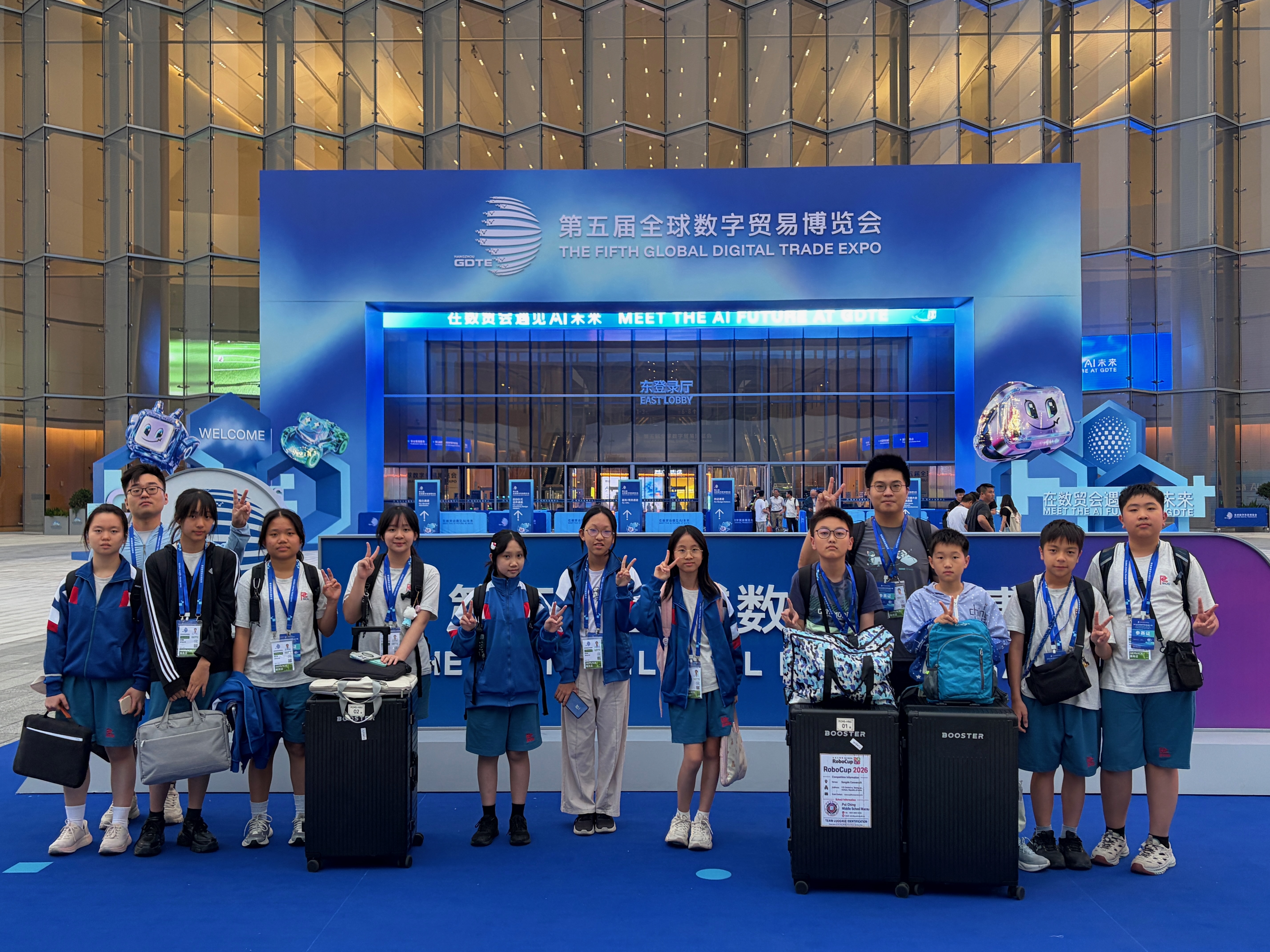 Group photo outside the competition venue in Hangzhou
